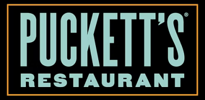 Text logo of Puckett's Restaurant on black background.